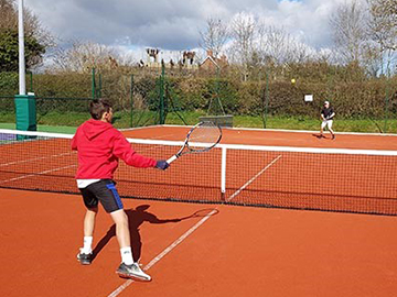 people playing tennis